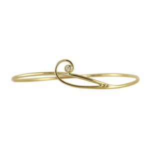 Simple twisted gold bracelet with a curl enclosing a diamond