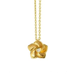 Hibiscus flower pendant with a shiny diamond