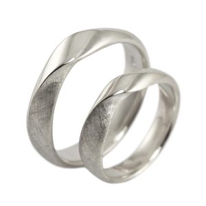 Heavy twisted wedding rings in white gold with both a polished and raw surface