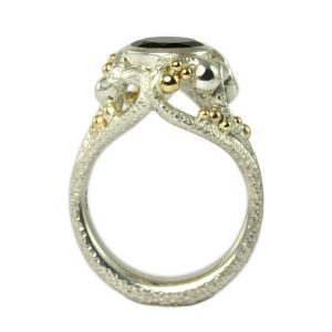 Beautiful winding reptile ring in silver with large black spinel and gold bubbles