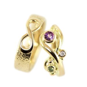 Wedding rings with symbols and diamonds