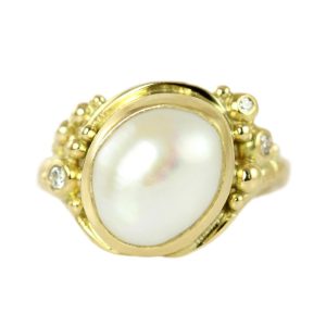 Semi-baroque gold ring with diamonds and a large freshwater pearl