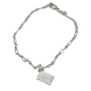 Bookish charm bracelet with small closed book in silver for reading nerds.