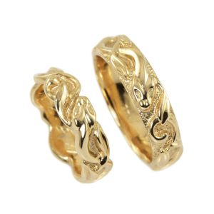 Twisting and coiling snake gold wedding rings