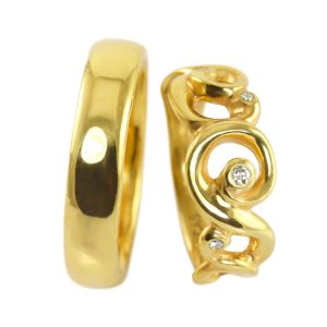 Cumulus wedding rings with scrolls and curls